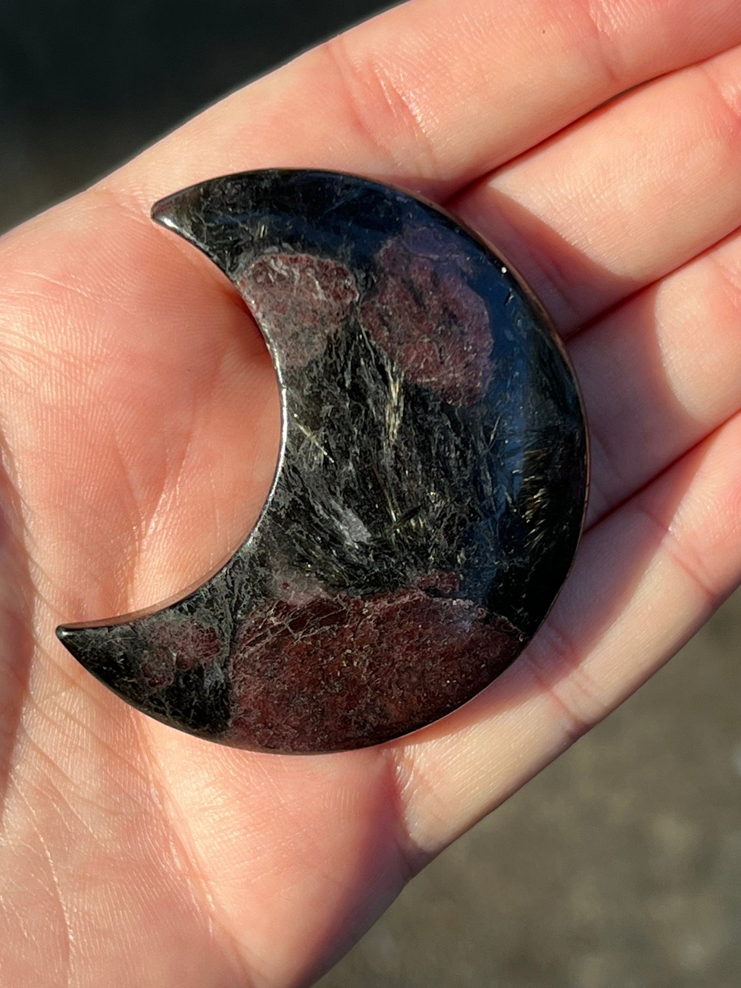 Garnet and Arfvedsonite Crescent Moon Carving